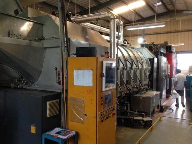 Launderaids German tunnel washer machinery showing continuous flow process